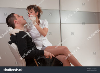 stock-photo-young-female-dentist-taking-care-about-her-patient-56012671.jpg